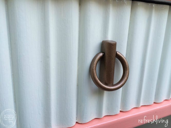 Vintage nightstands get a pop of color with pink and fabric