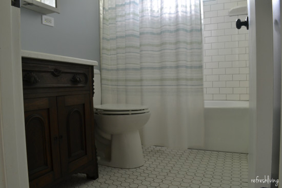 bathroom with antique washstand sink